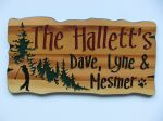 Rustic wood sign trees golfer family name and members name with dog paw print
